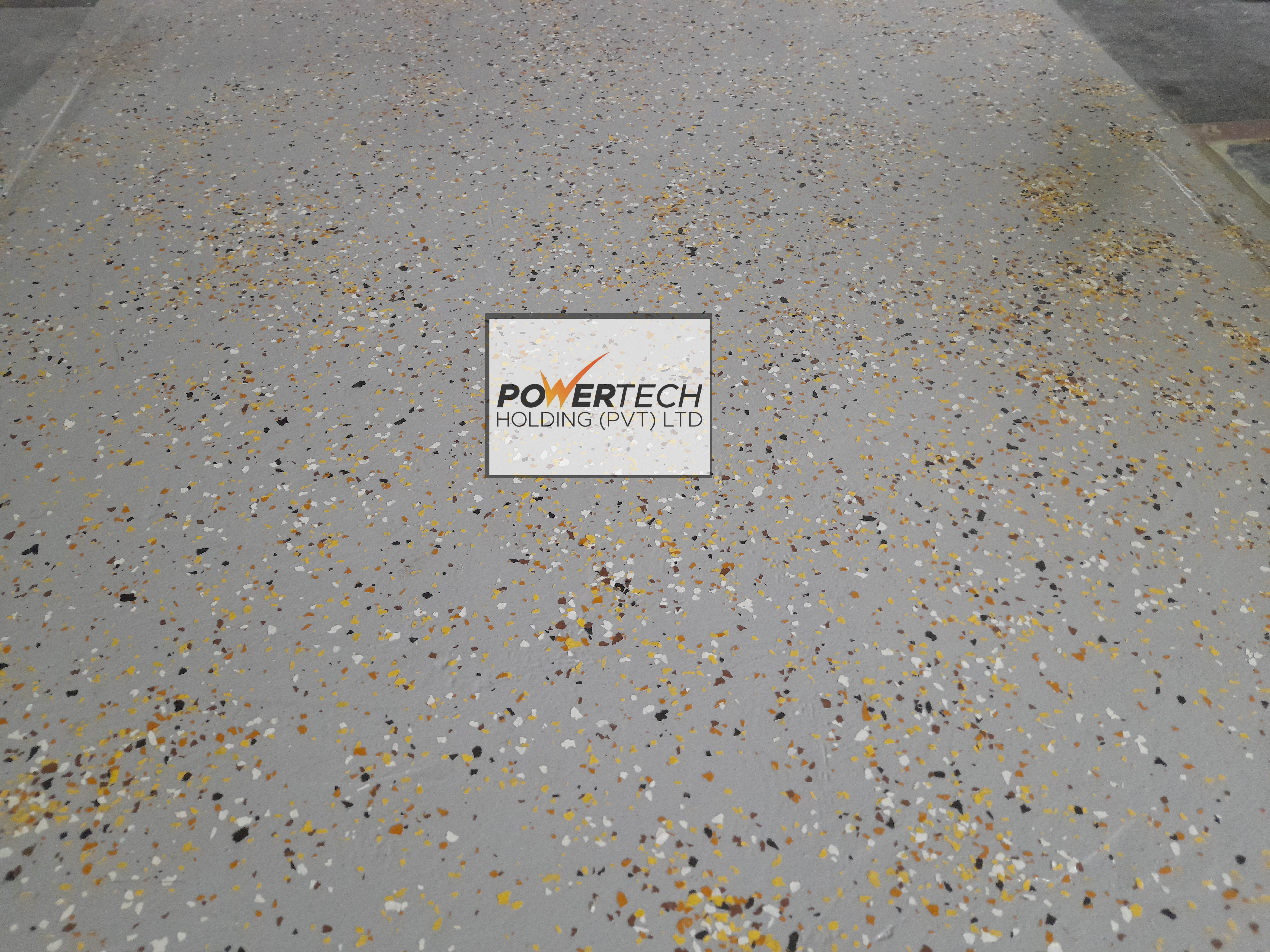 epoxy flake floor with helicopter in storage