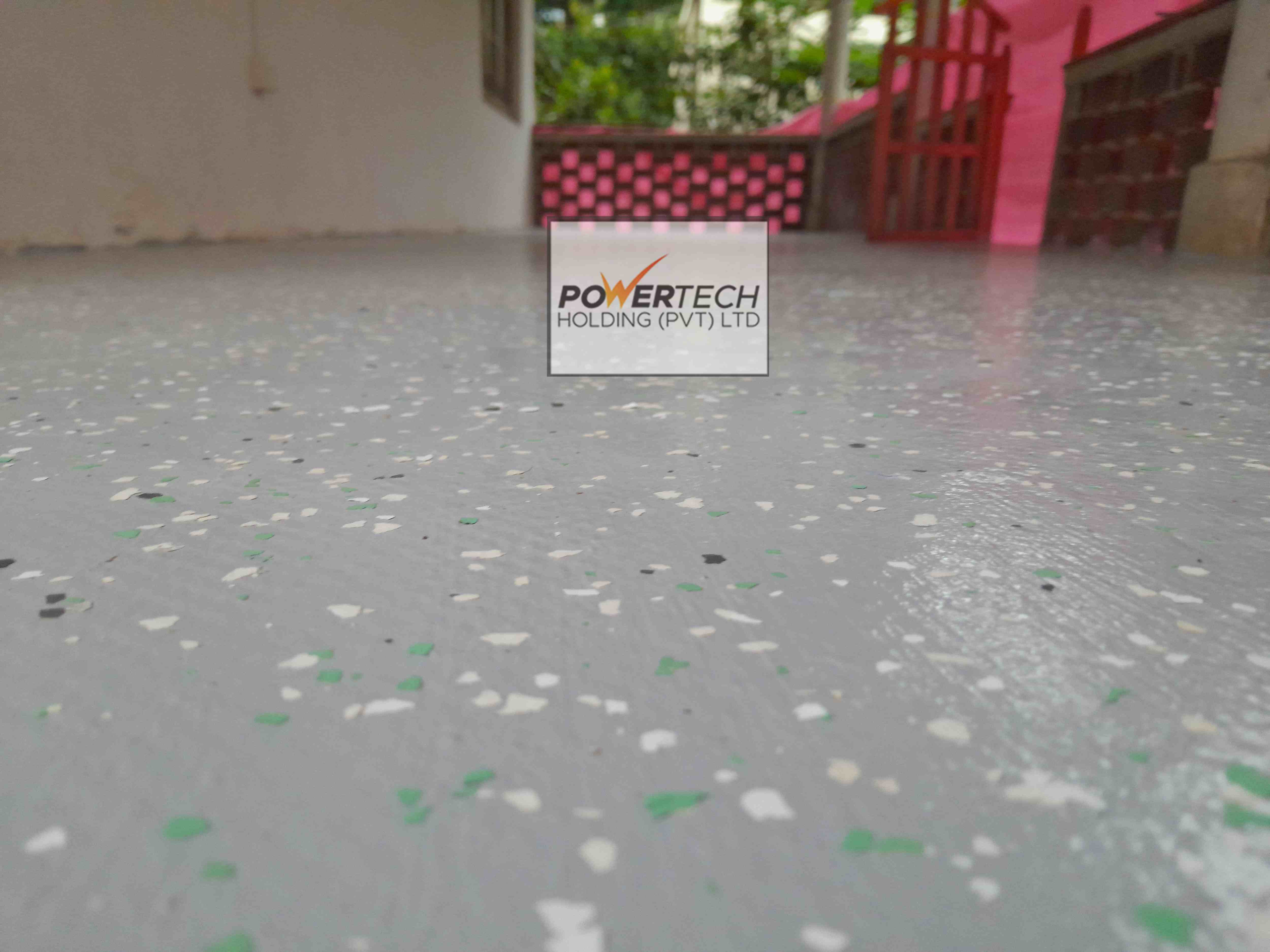 epoxy flake floor with helicopter in storage