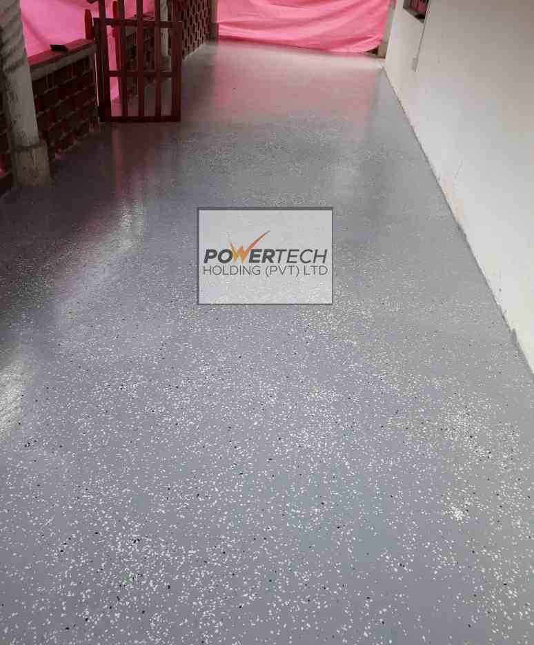 epoxy flake floor with helicopter in storage