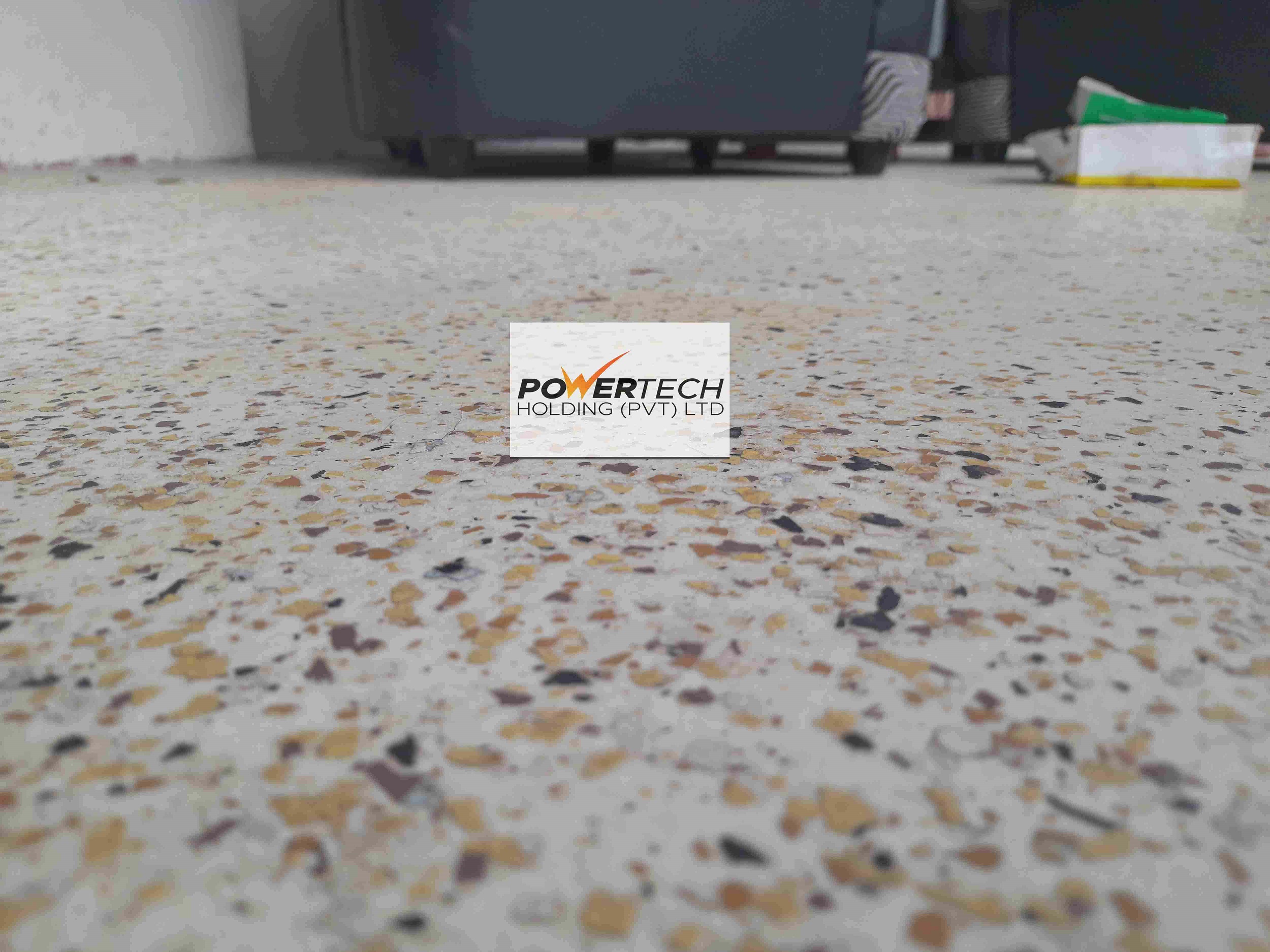 epoxy flake floor with helicopter in storage